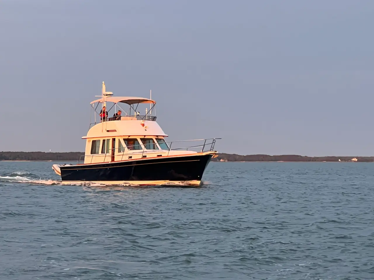 A downeast cruiser under way at dusk on the Chesapeake