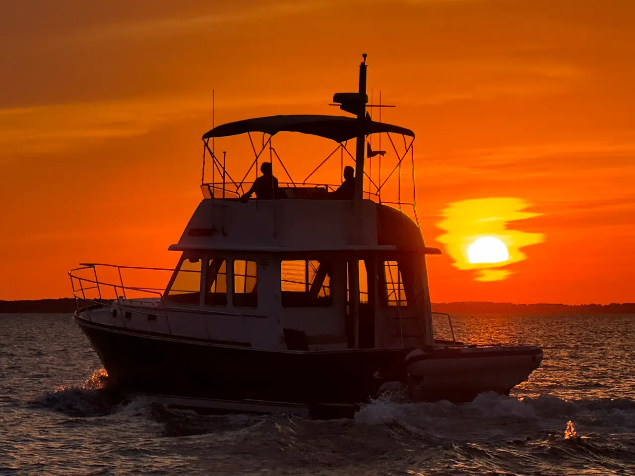 A trawler running home into the sunset, the hour somebody ashore is waiting for